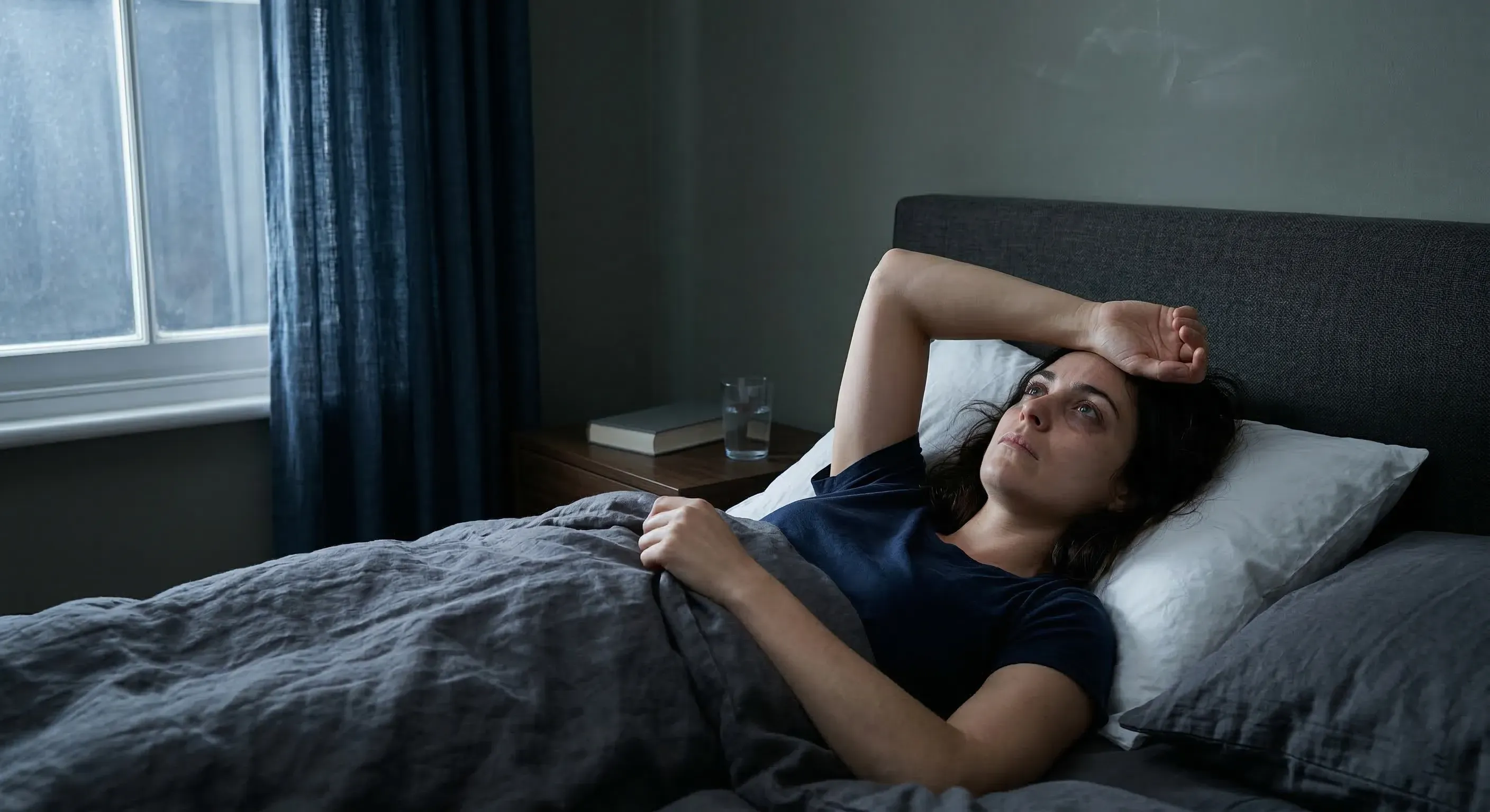 person awake in bed at night